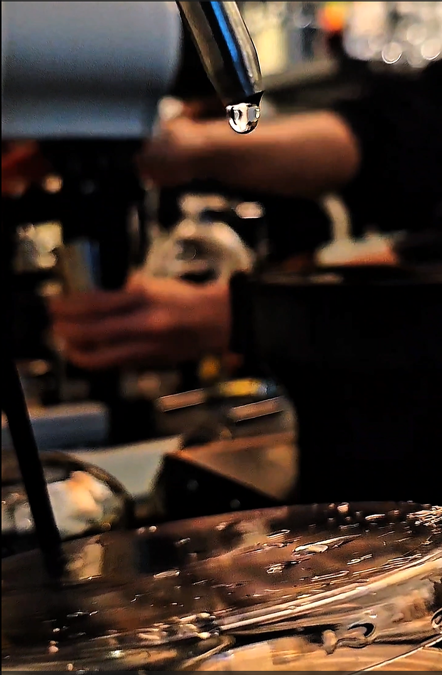 Siphon coffee brewing close-up with water droplet at The Hidden Lab Malaysia
